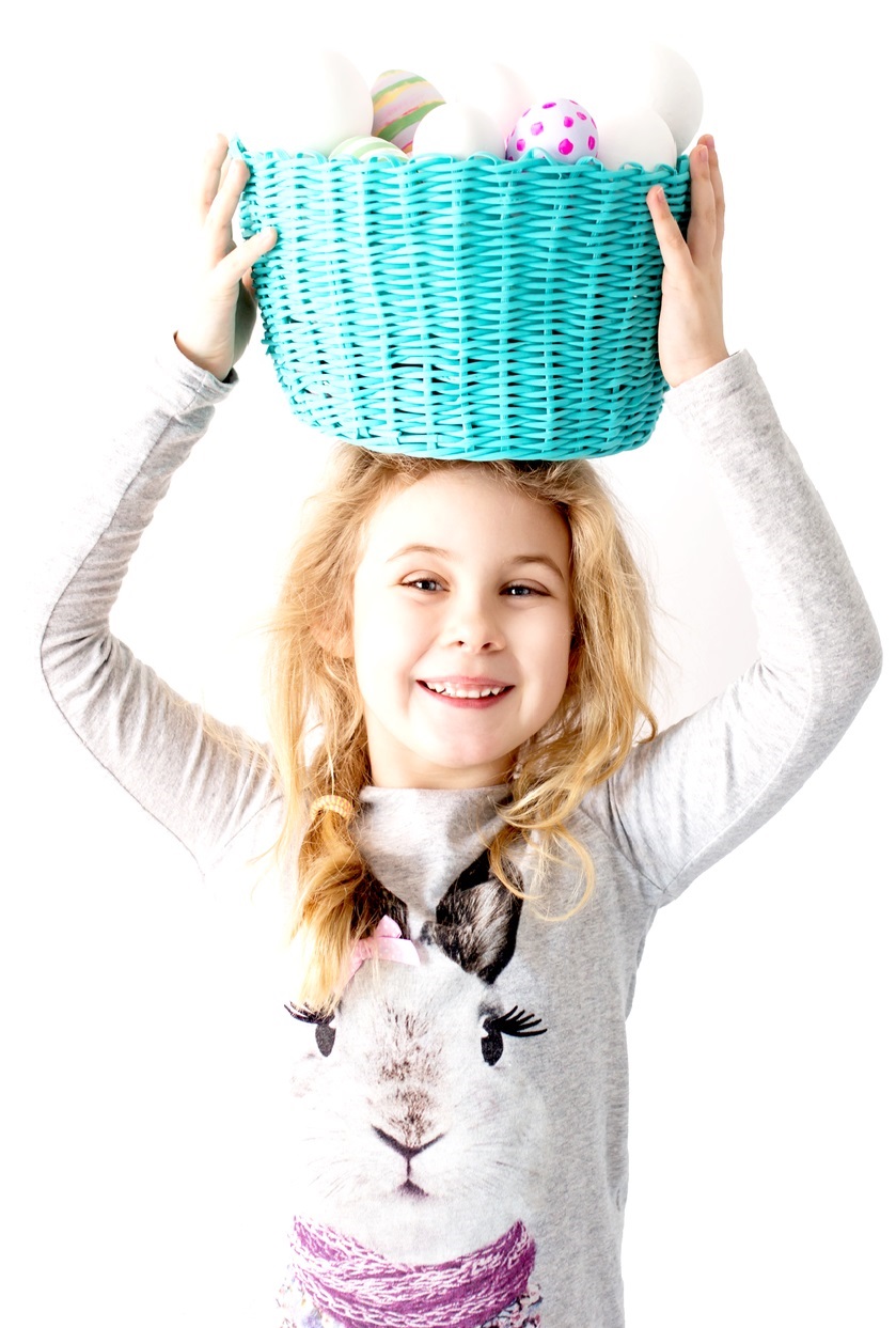 girl with a basket full of easter egg